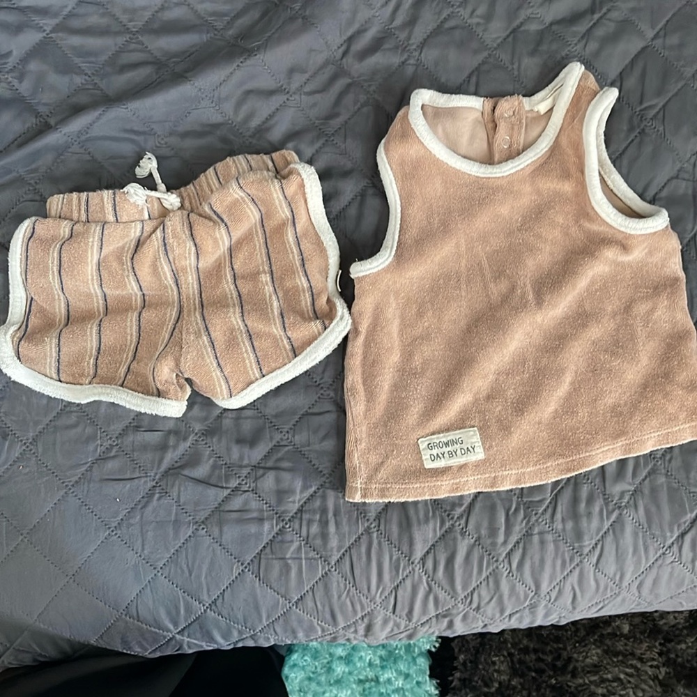 This is a tan cute kids set. Size 18m.